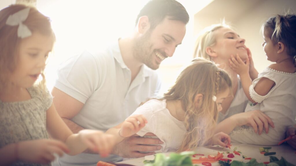 Happy family preparing a healthy meal together.